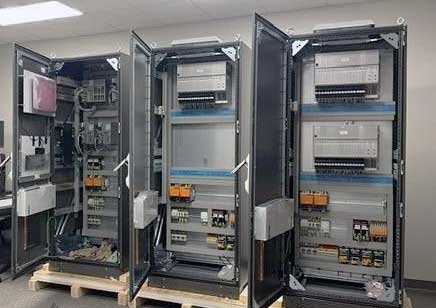 Three cabinets standing in a row at the workplace of PROGNOST Houston.